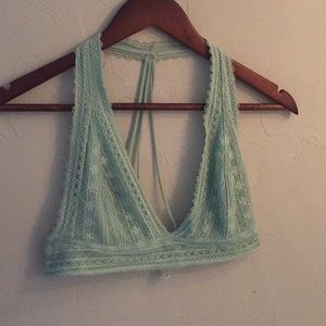 Out from under mint green lacy bralette